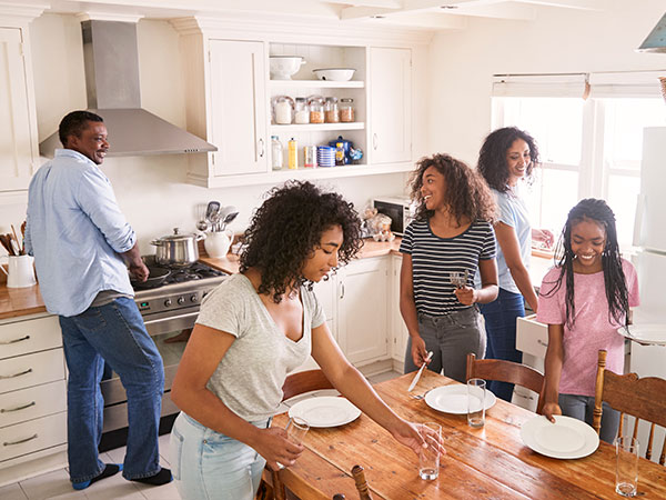 Family preparing the home for the next day during the evening