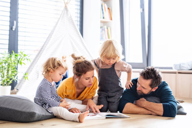 Family reading together indoors