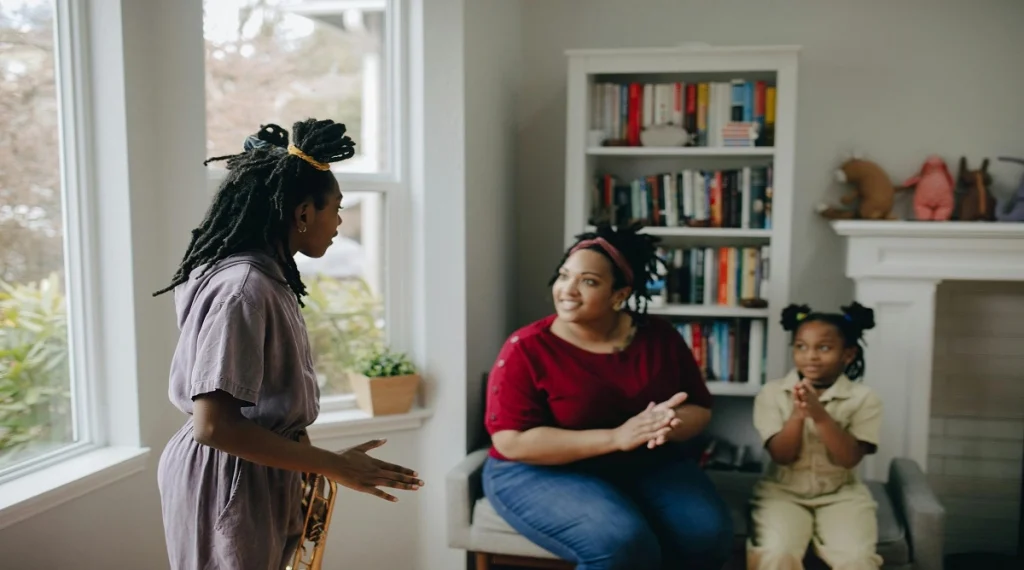Parent listening calmly while a child explains a situation at home