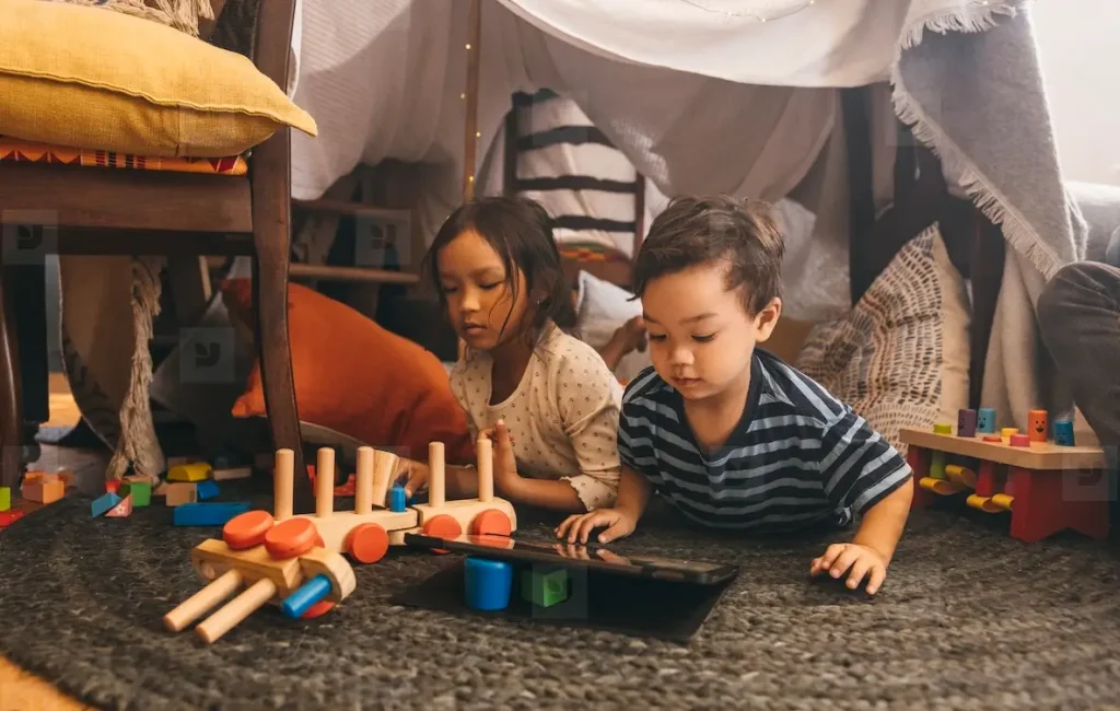 Siblings playing together at home