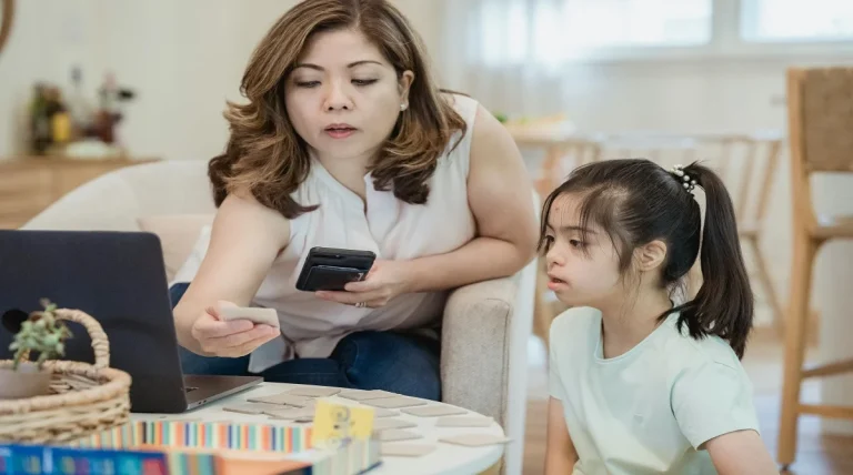 Parent supporting a child through a frustrating moment at home