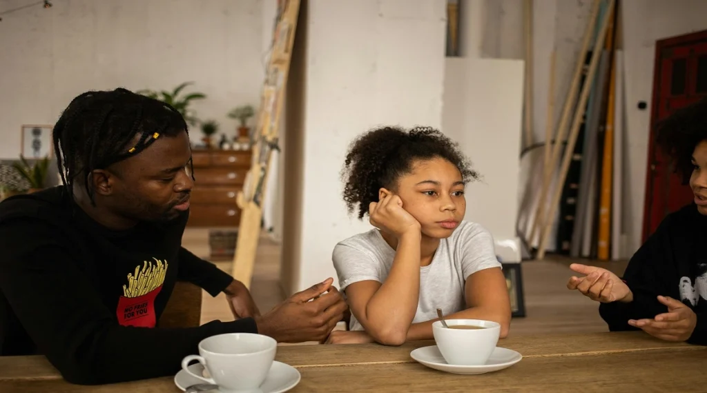 Child thinking carefully during a calm home conversation with a parent
