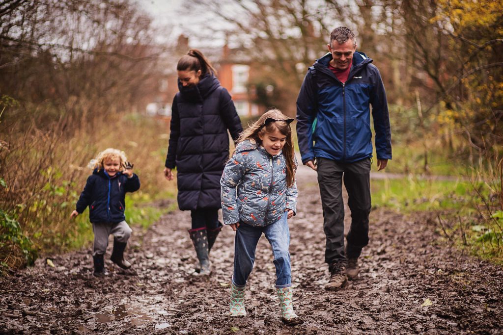 Family taking a regular walk together outdoors