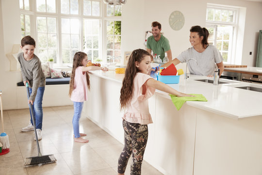 Family sharing simple household chores together