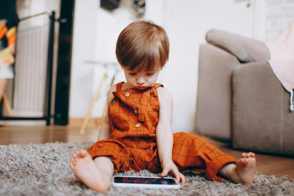 Child playing without a visible device nearby during screen-free family time