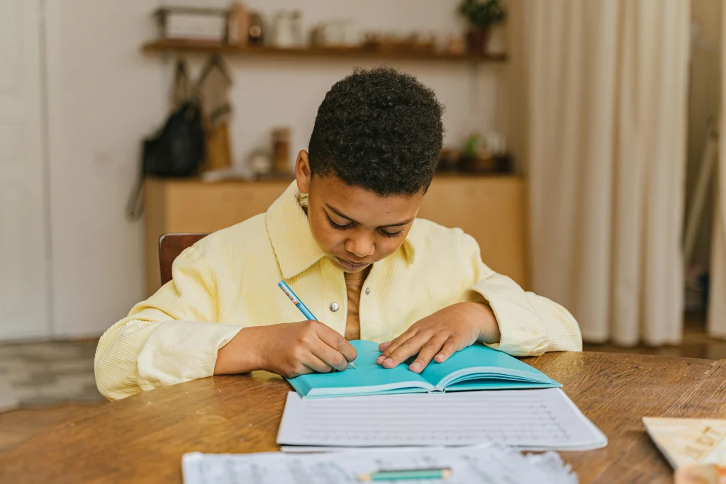 Child practicing a repeated daily habit with school items at home