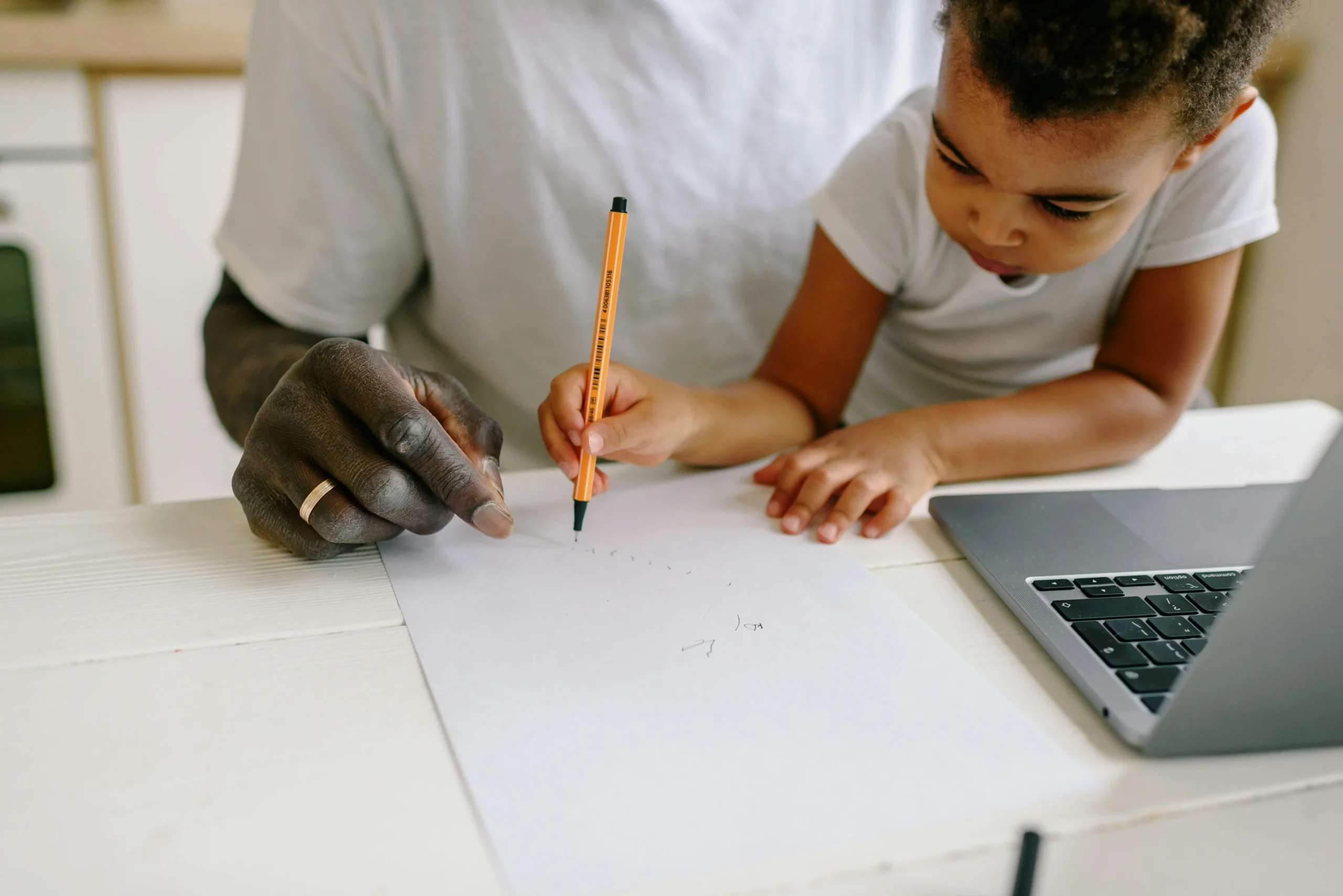 Parent and child using a familiar home learning space together