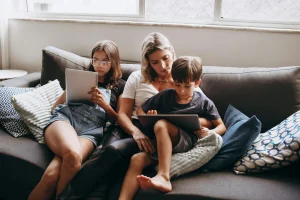 Parent putting a tablet away in a shared family space to support screen limits