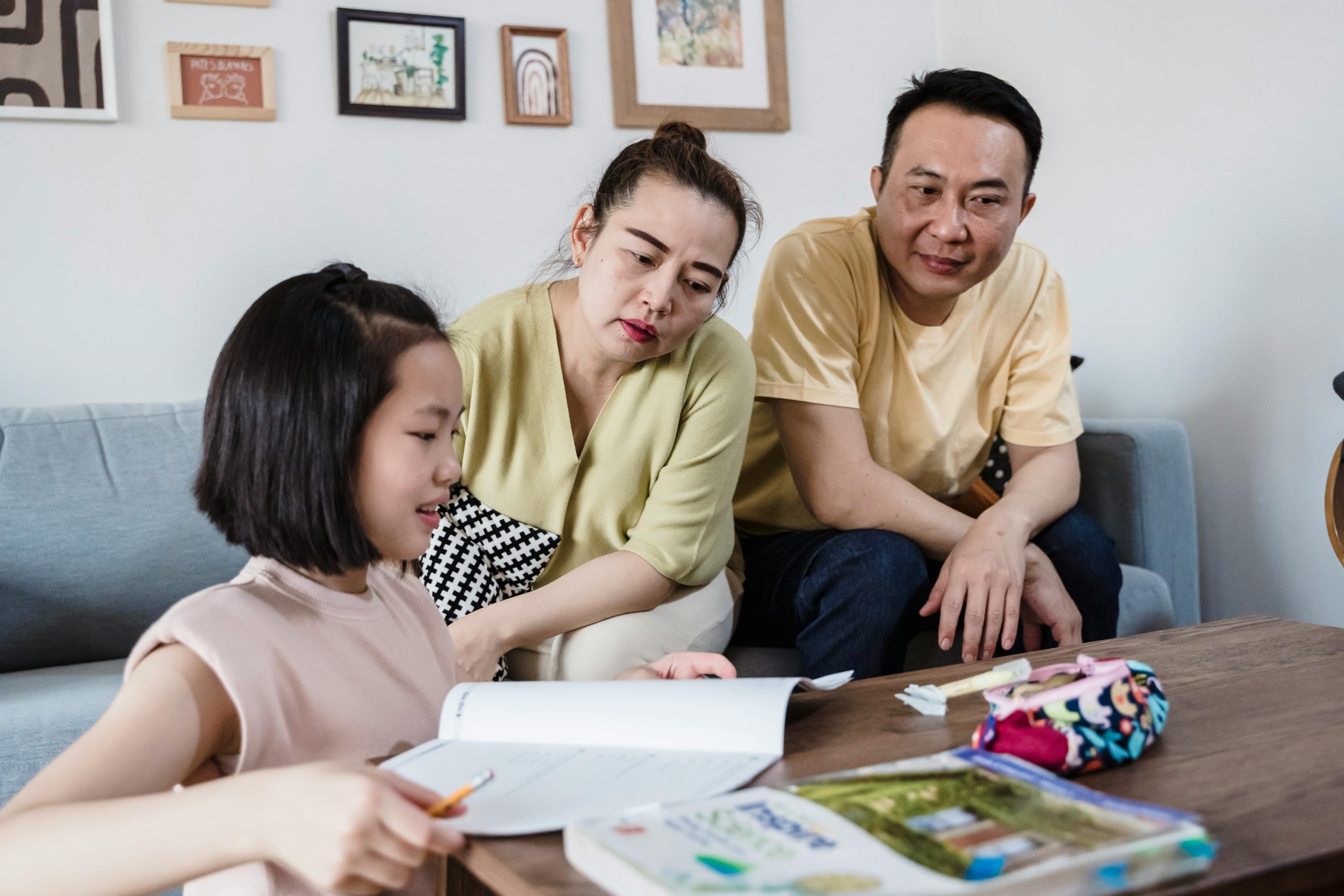 Parents supporting child in a home learning environment