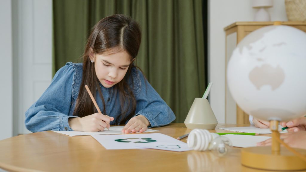 Child starting a familiar home practice activity at a table