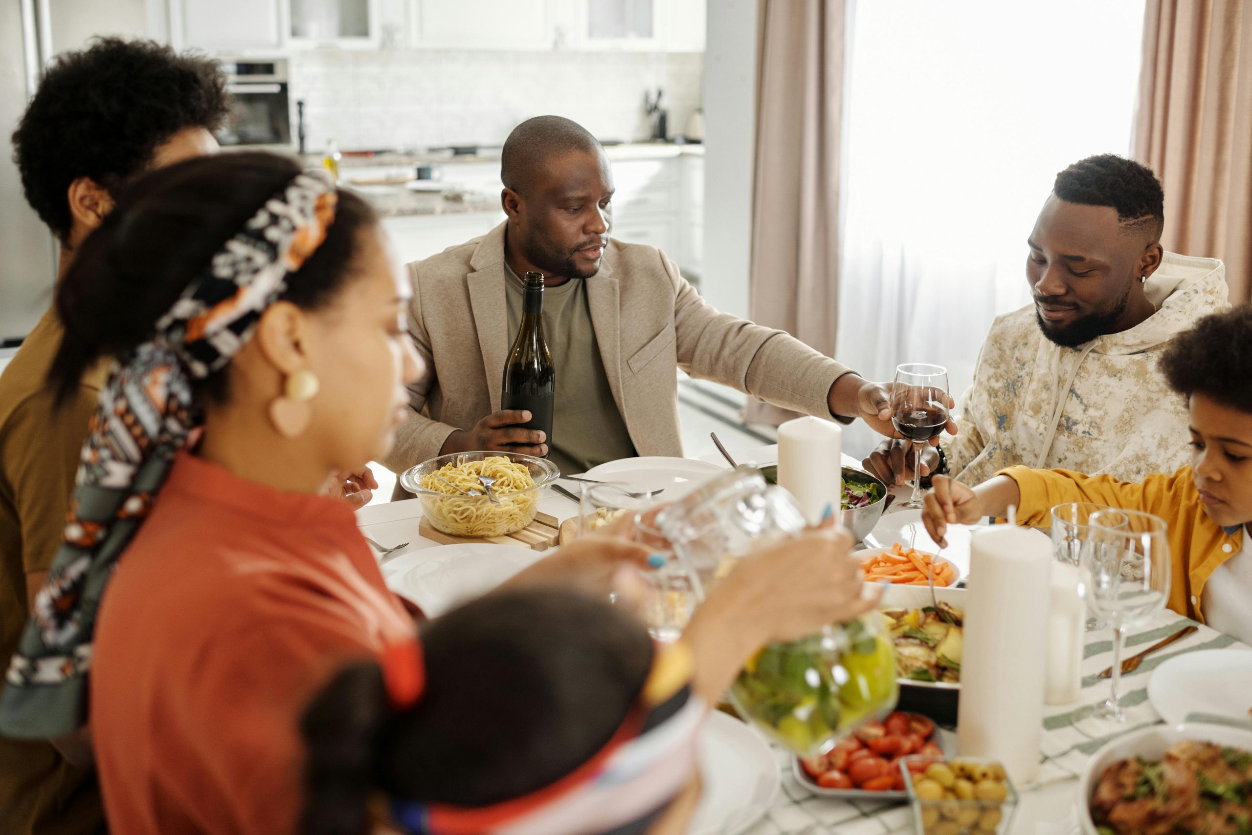 Family gathered around a dinner table at home