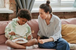 Parent giving a calm instruction to a child at home