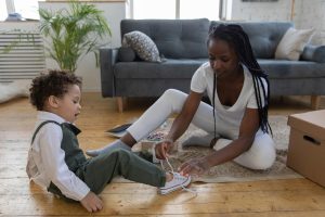 Parent helping a child learn through everyday activities at home