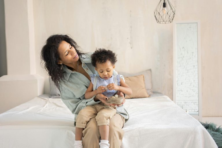 Parent helping a young child through frustration