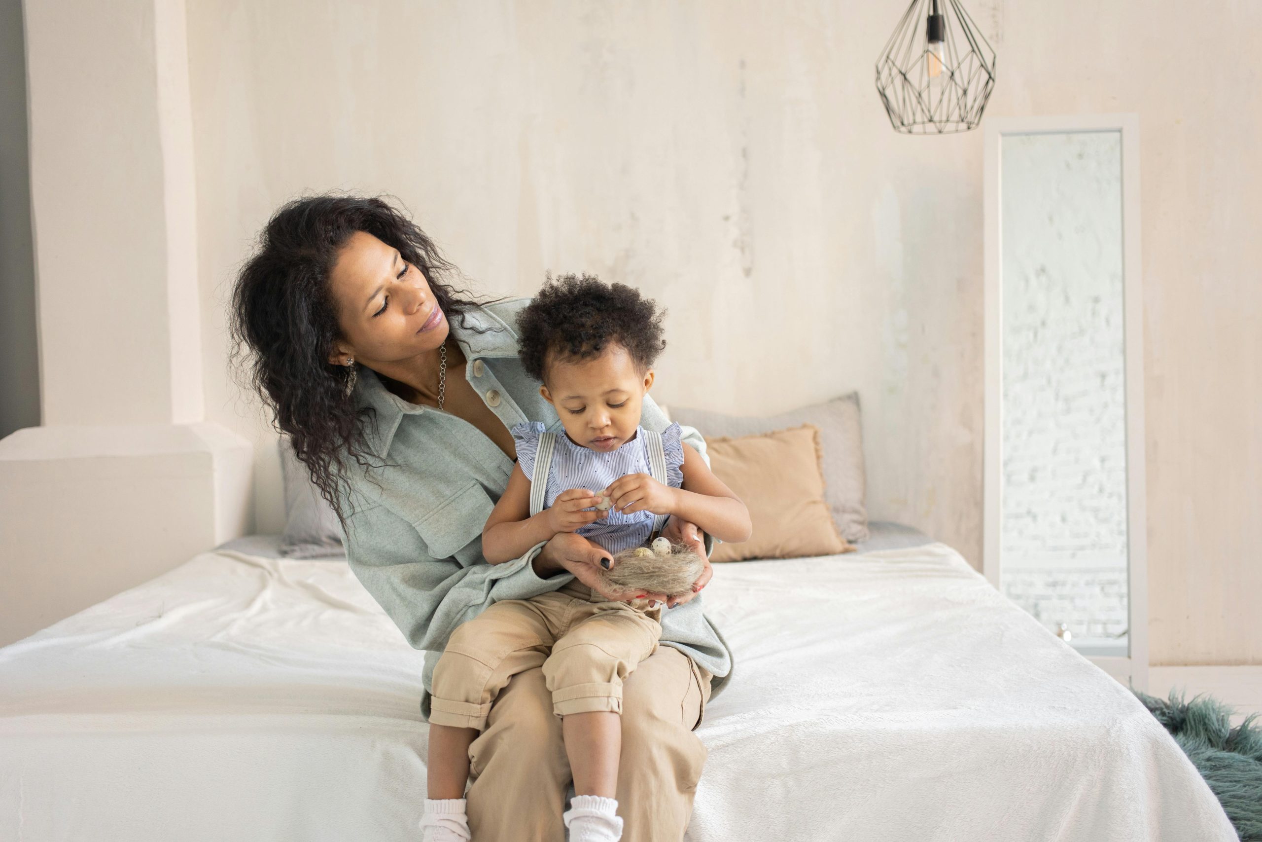 Parent helping a young child through frustration