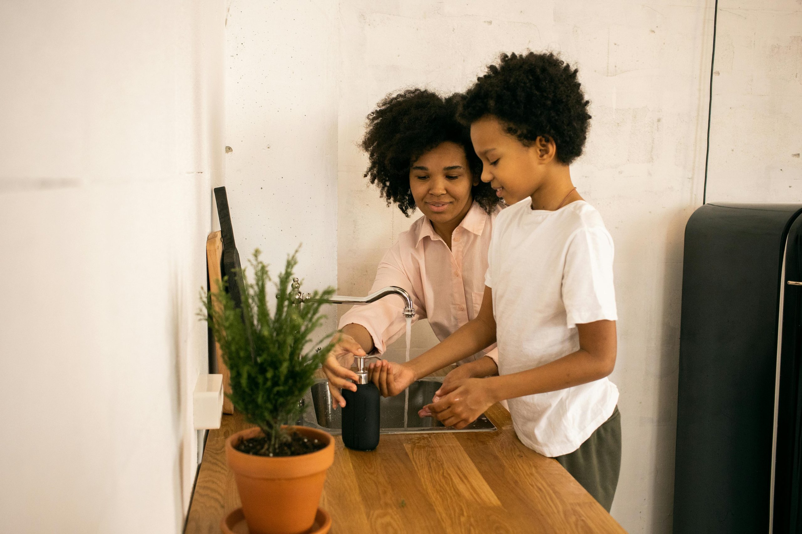 Parent helping a child move through a daily routine at home