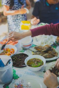 Shared family meal with several dishes on a table