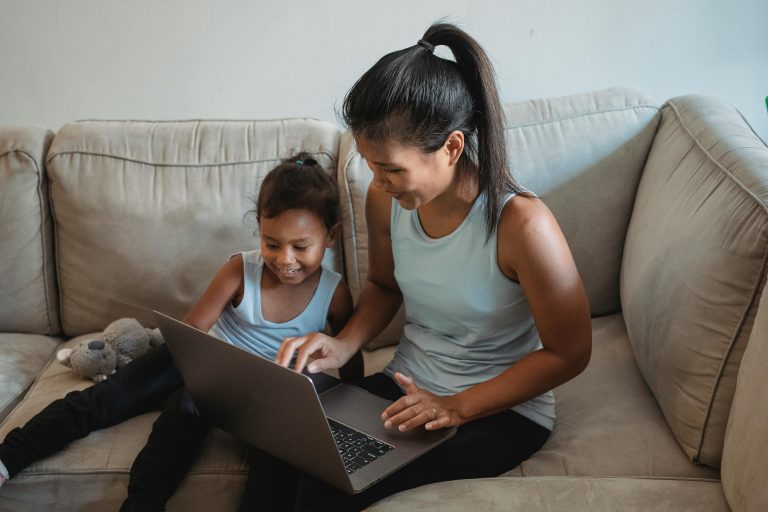 Parent helping a child transition from screen time to a screen-free activity at home