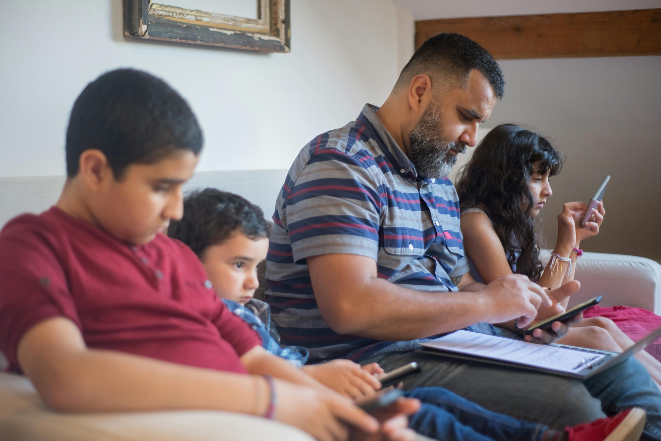 Family navigating device use during a busy day at home
