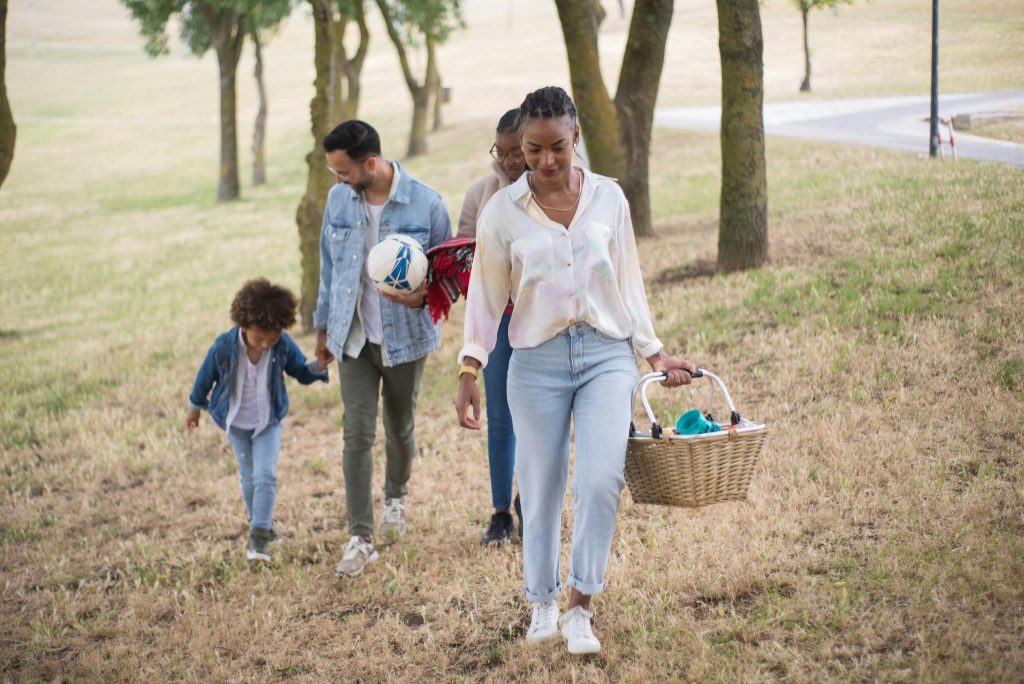 Family taking a familiar weekend walk together outdoors