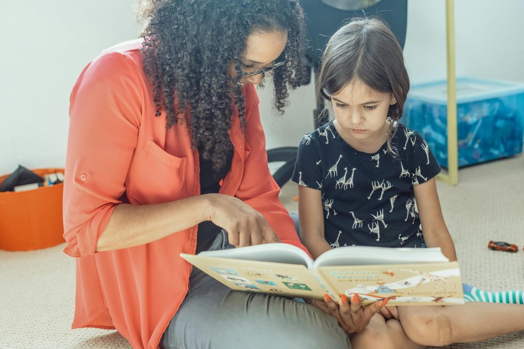 Family sharing a reading routine at home