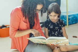 Family sharing a reading routine at home