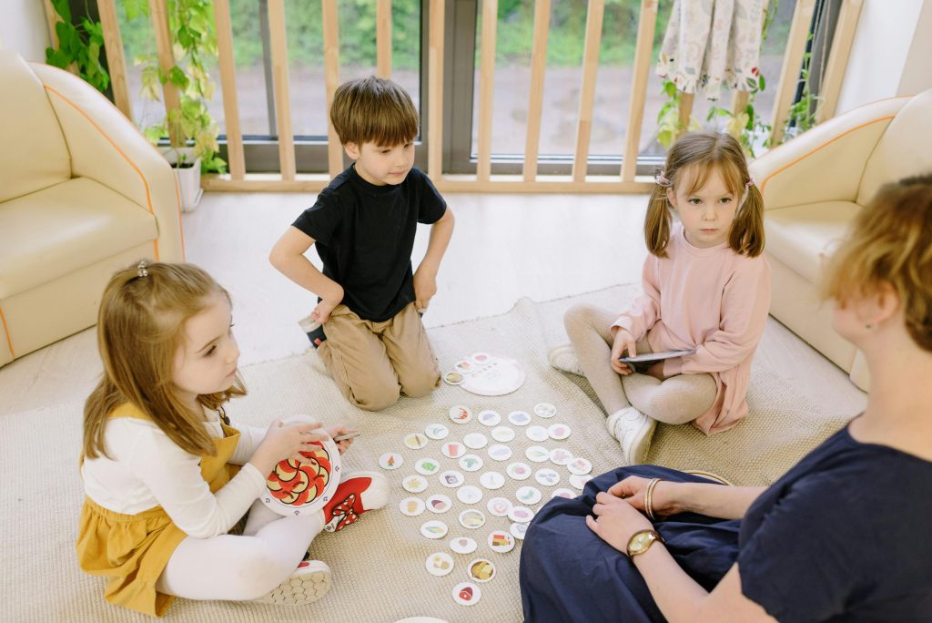 Preschool children practicing turn-taking during a group activity