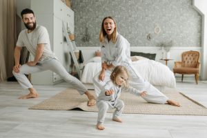 Parent helping children during a morning routine at home