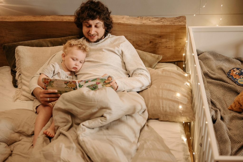 Parent reading a bedtime story during a calm evening routine