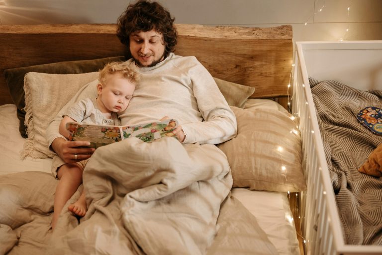 Parent reading a bedtime story during a calm evening routine