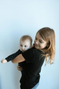 Siblings playing together at home