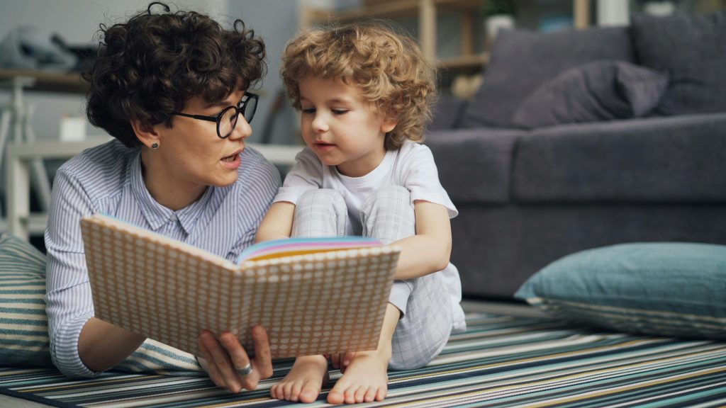 Child listening during story time with an adult