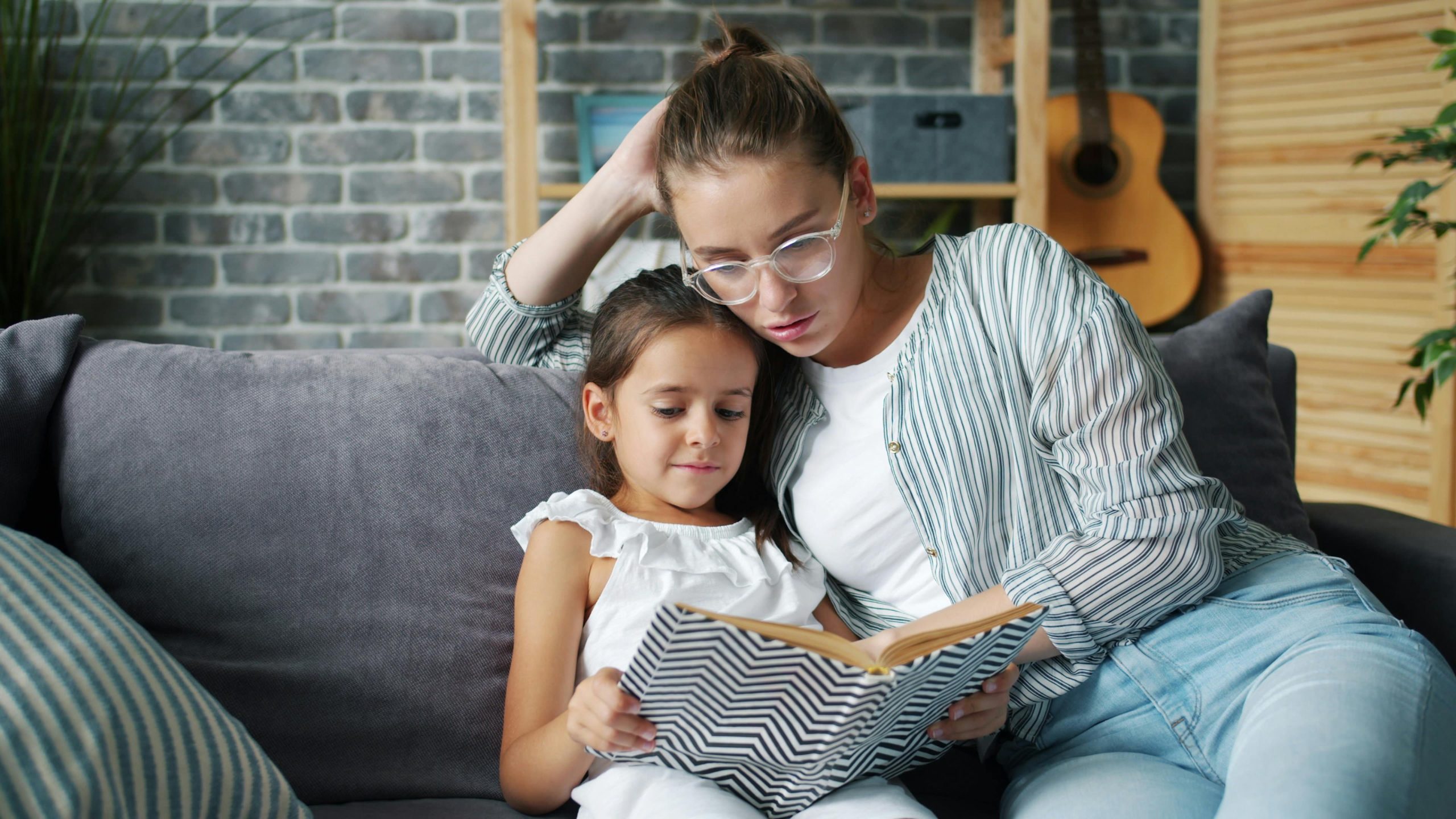 Parent reading with a child during an early learning routine