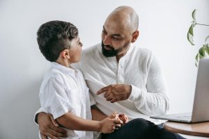 Parent speaking calmly with a child during a quiet conversation