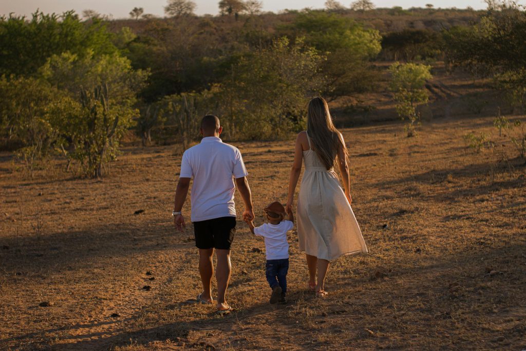 Parent and child enjoying a seasonal walk together