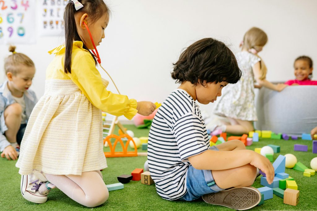 Preschool children playing together in a shared setting