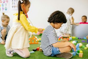 Preschool children playing together in a shared setting