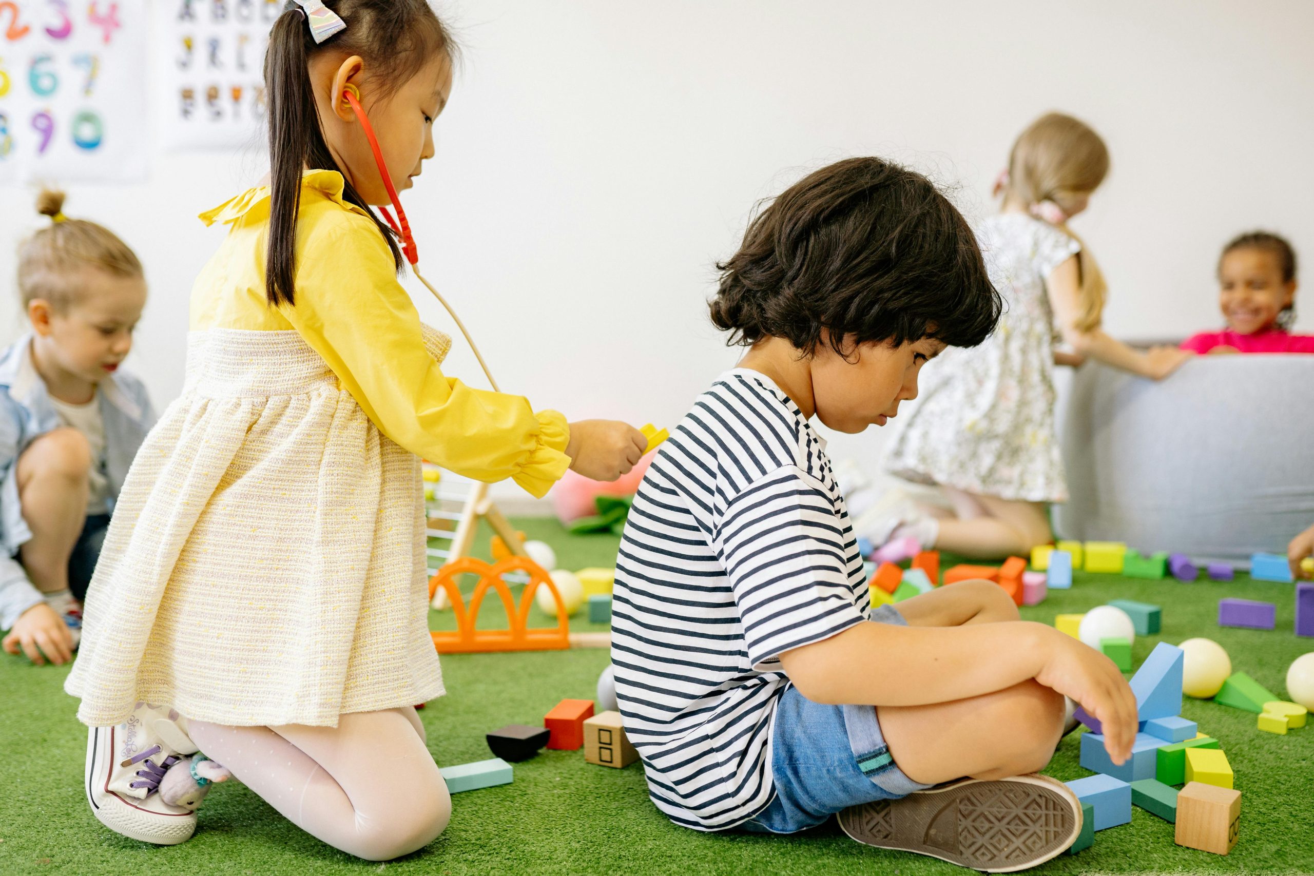 Preschool children playing together in a shared setting
