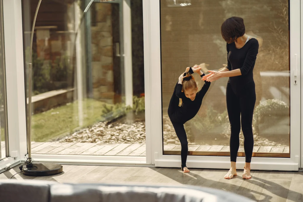Child practicing flexibility during a routine change with a parent nearby