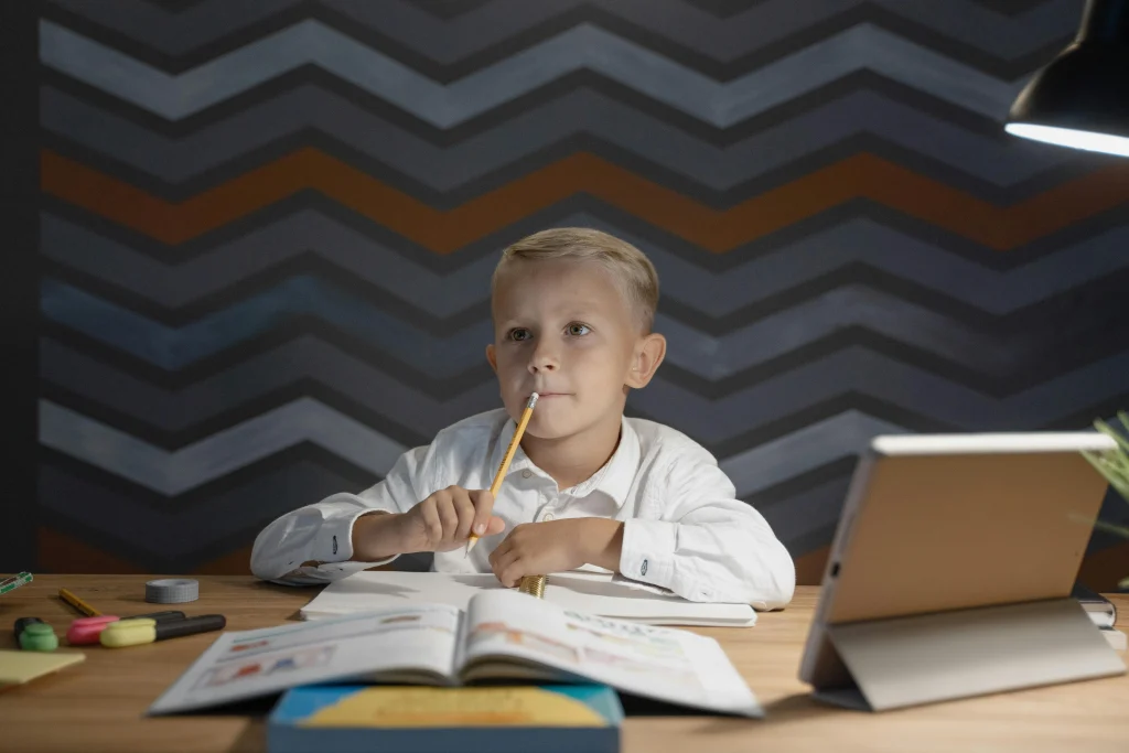 Child thinking before answering a home learning question
