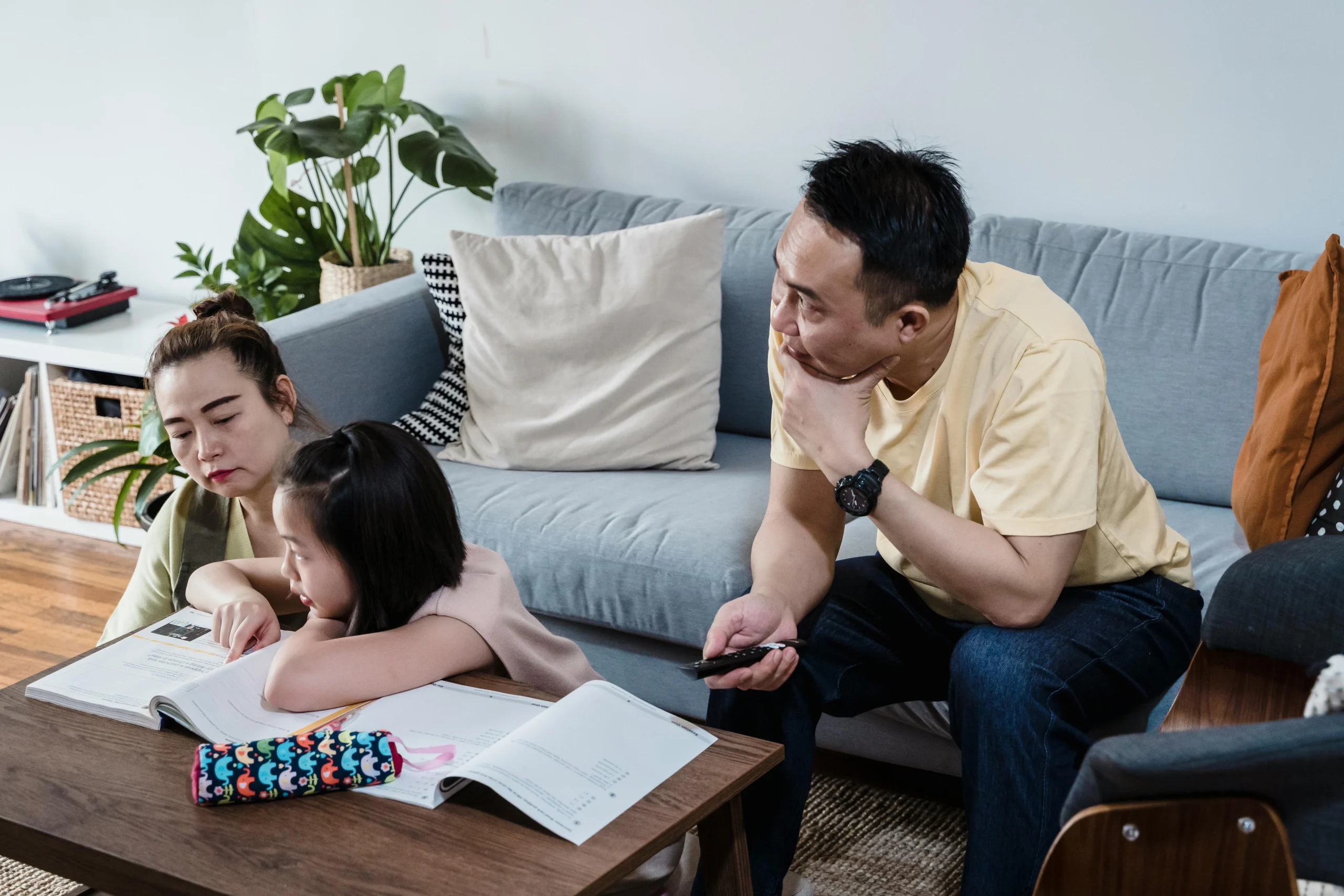 Parent pausing after asking a child a learning question at home