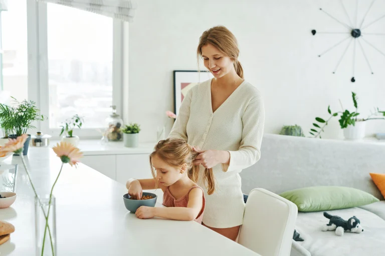 Parent preparing the next routine step for a child at home