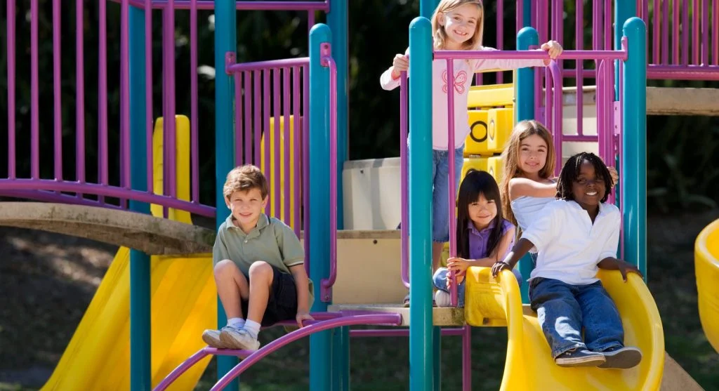 Two children playing creatively outdoors