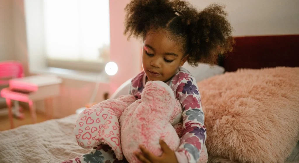 Child acting silly in pajamas as bedtime approaches