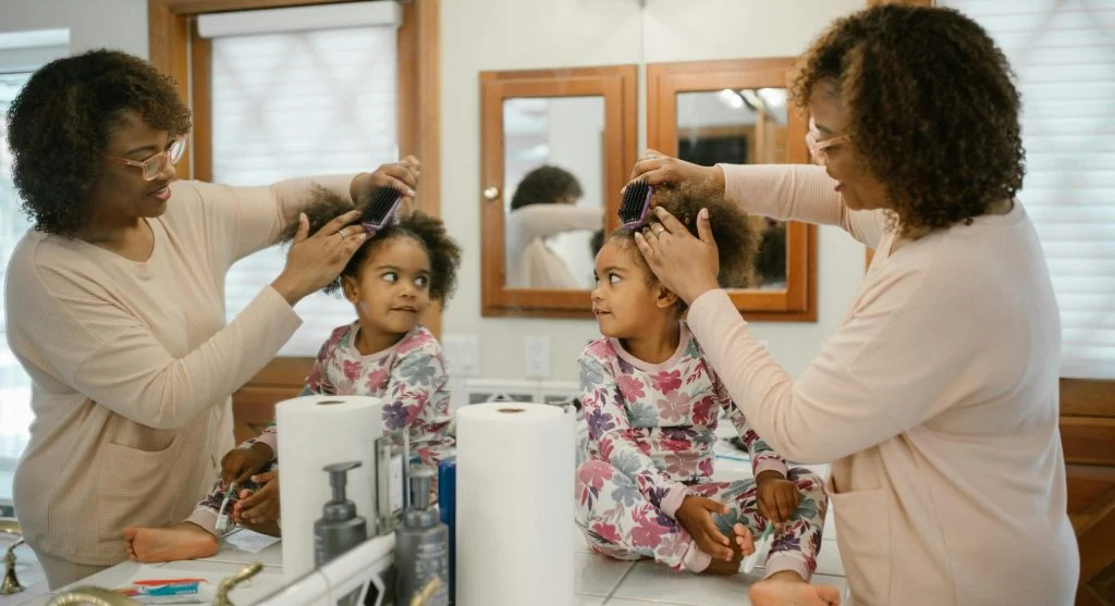 Parent using a prepared routine object to help a child transition at home