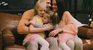Parent calmly describing a situation while talking with a child at home