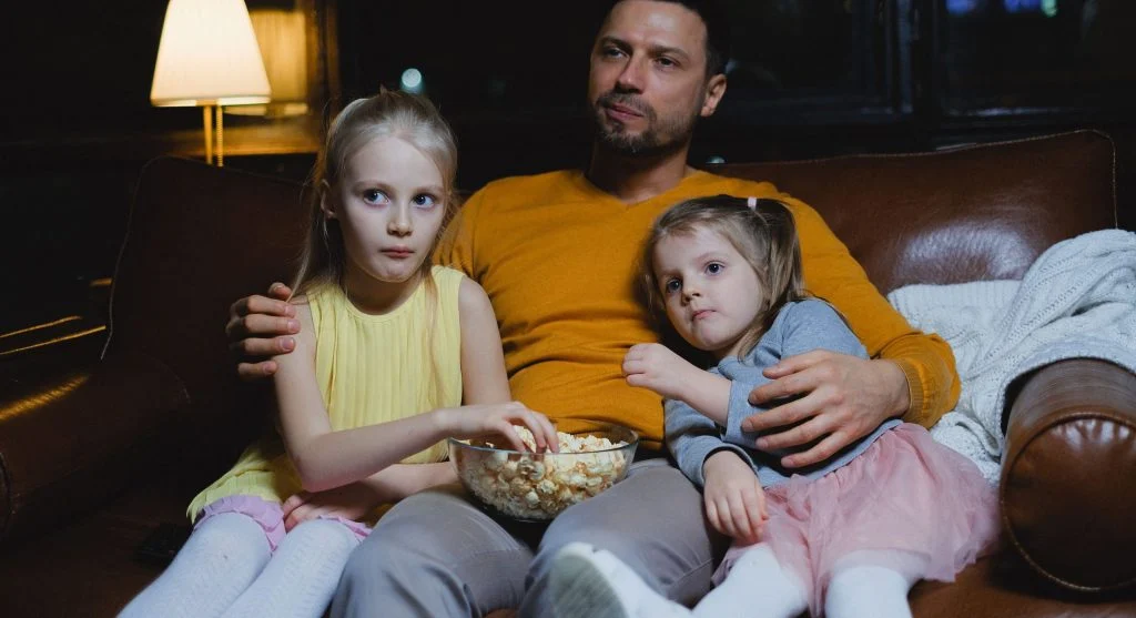 Family deciding what to watch together before TV time begins