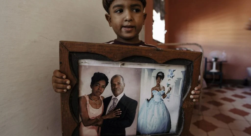 Family remembering a tradition through the child’s familiar role in it