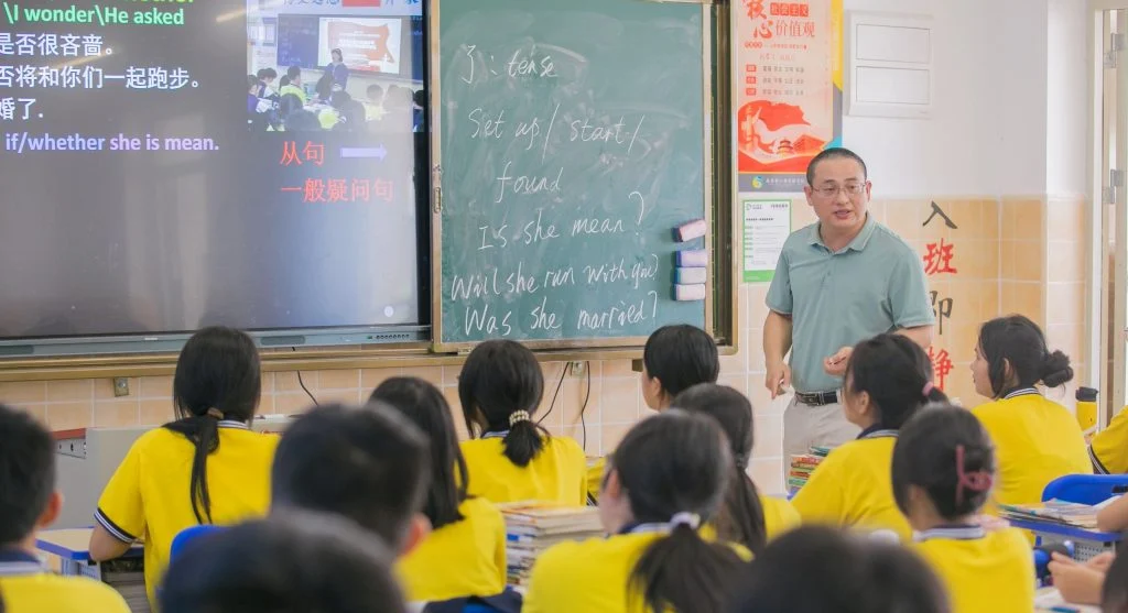 Parent explaining a learning idea in simple language before worksheet practice