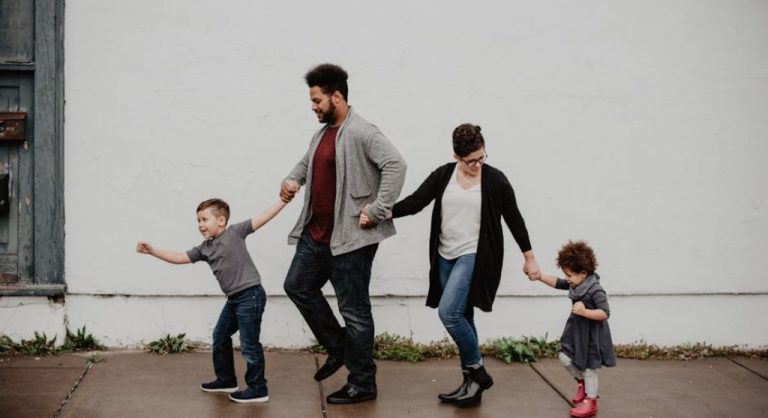 happy family walking together outdoors